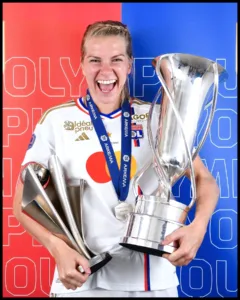 Ada Hegerberg with the trophy