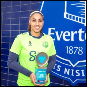Gabby George with an award
