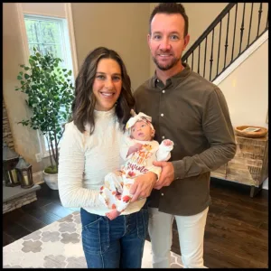 Carli Lloyd with her husband and baby
